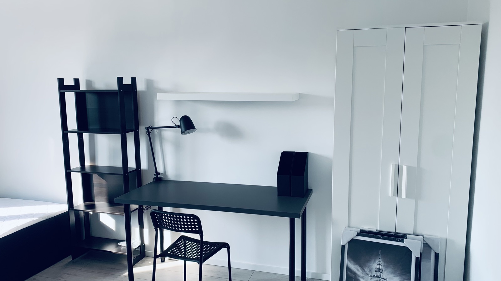 Desk, shelving and wardrobe in the room
