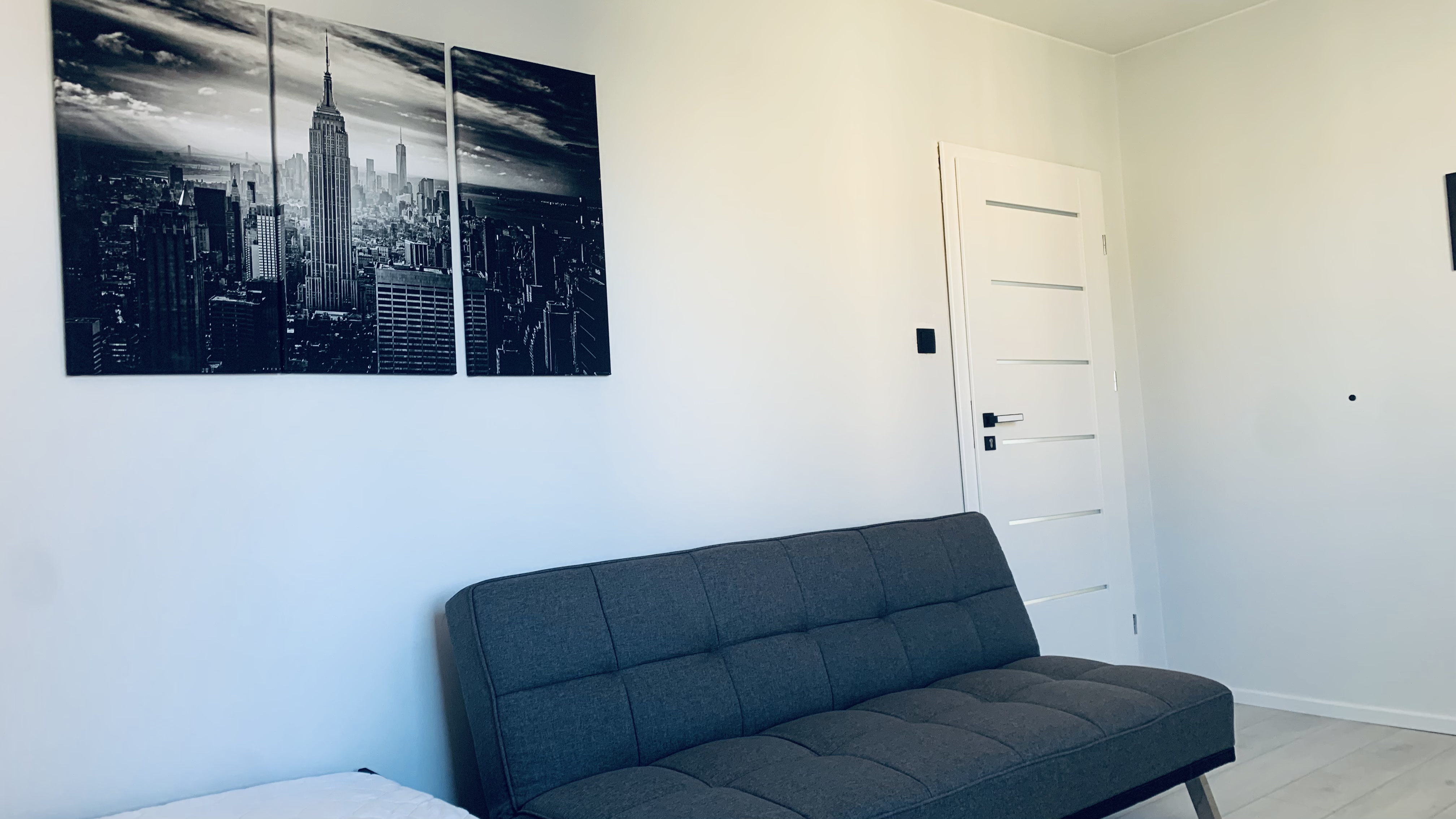 Sofa and wall art in Borowska room #2