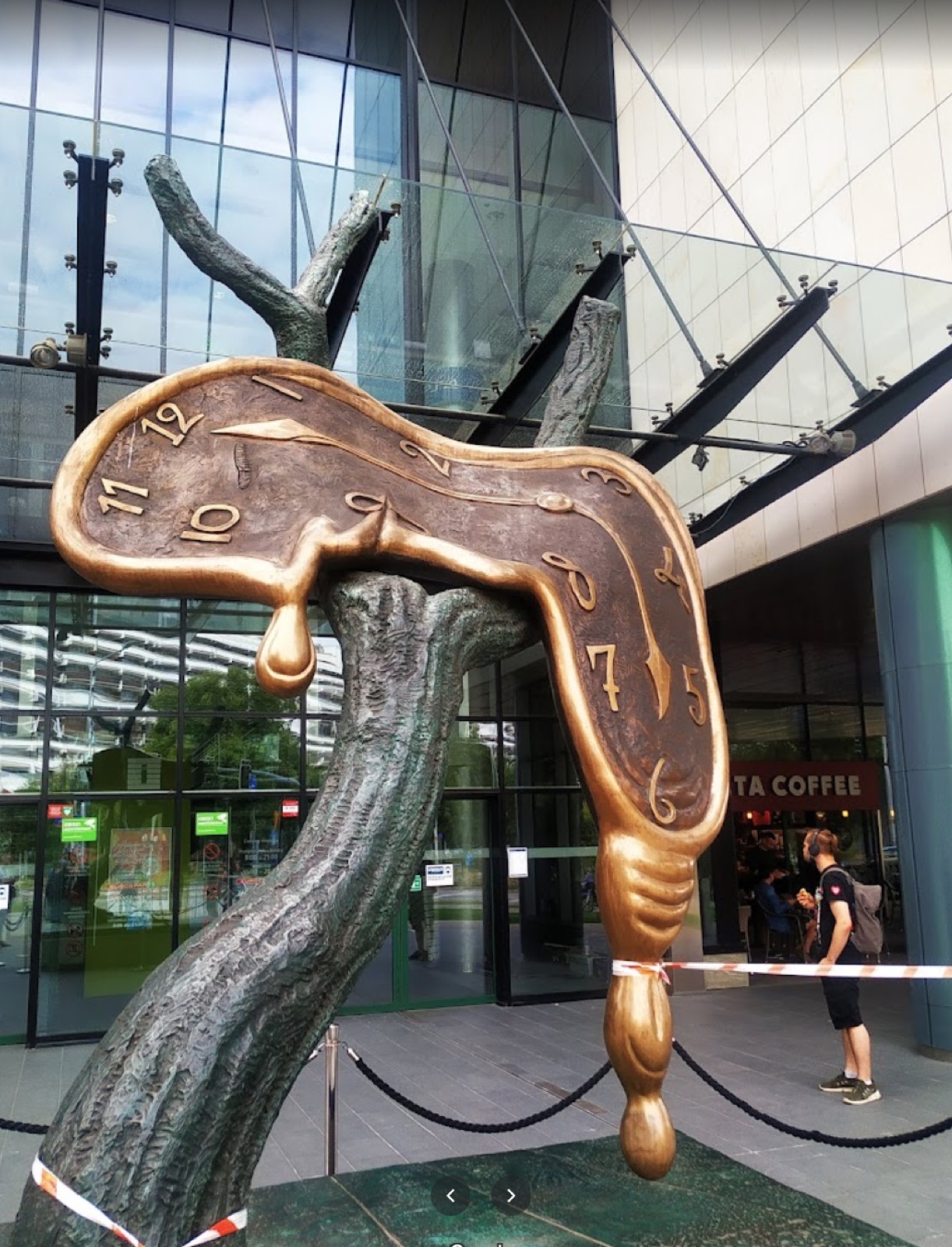 Sculpture outside a modern glass building in Wrocław
