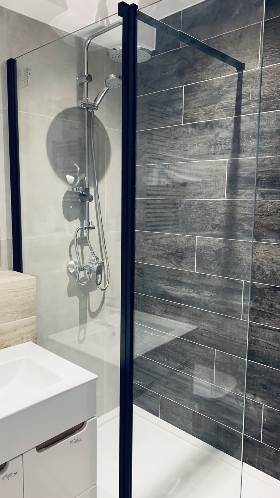 Walk-in shower in the shared Borowska apartment bathroom