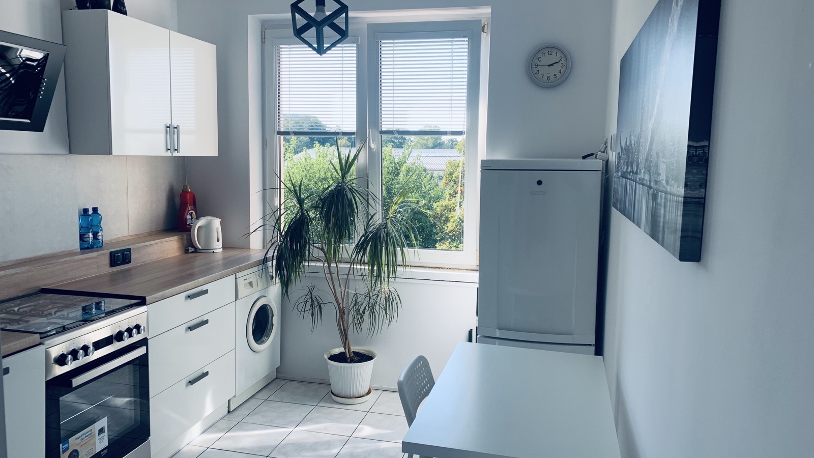 View across the shared Borowska apartment kitchen and dining area