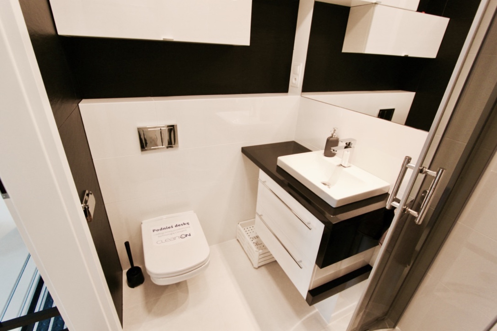 Shared bathroom vanity and toilet in the Widok apartment
