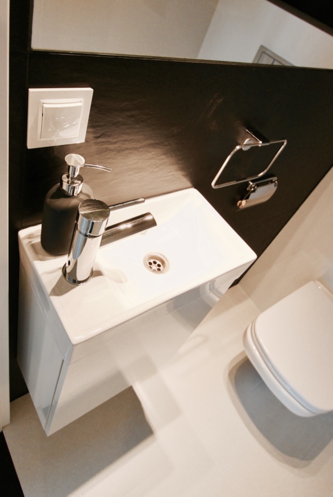 Close view of the washbasin in the separate shared WC