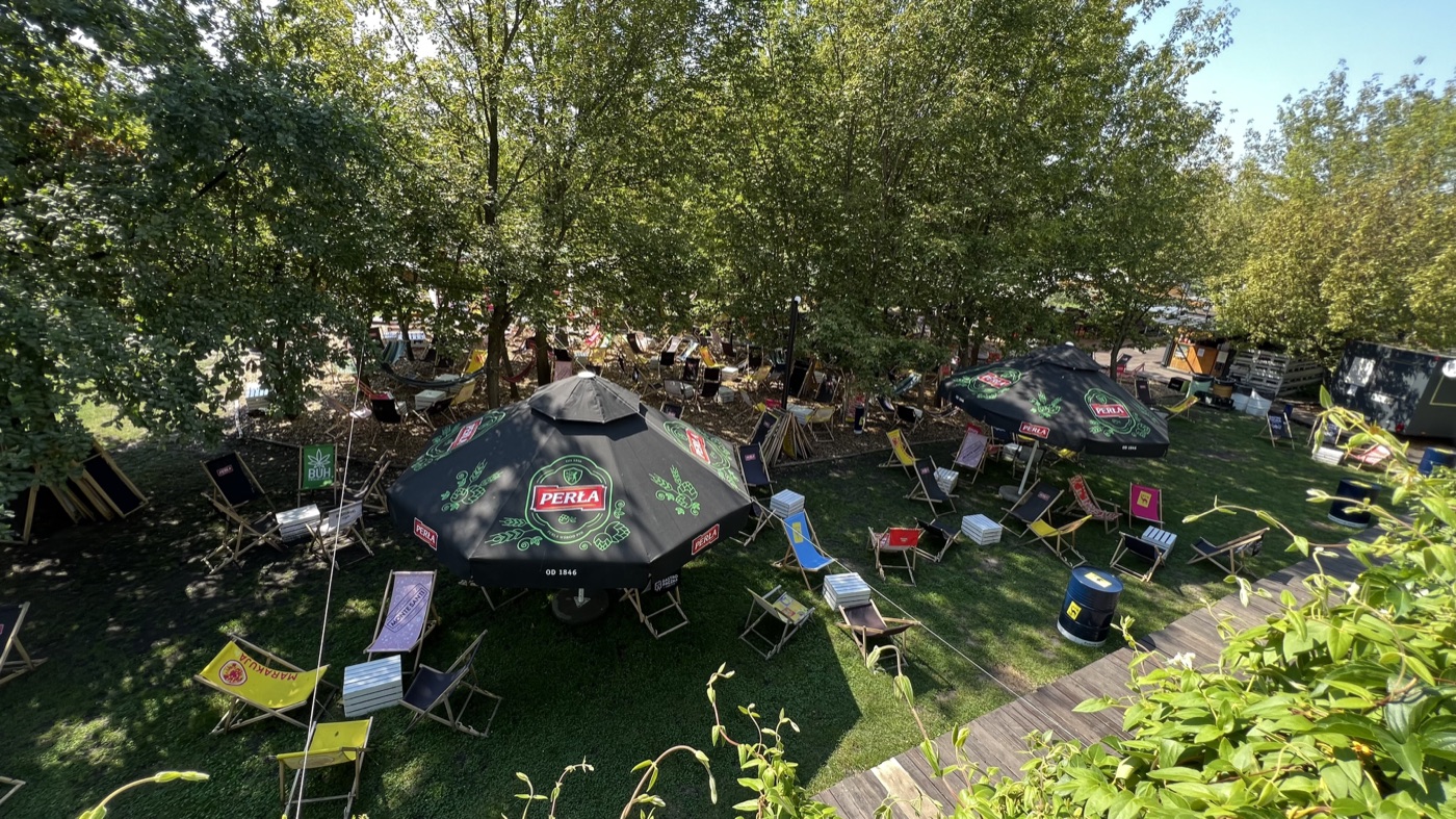 A shaded riverside beach bar